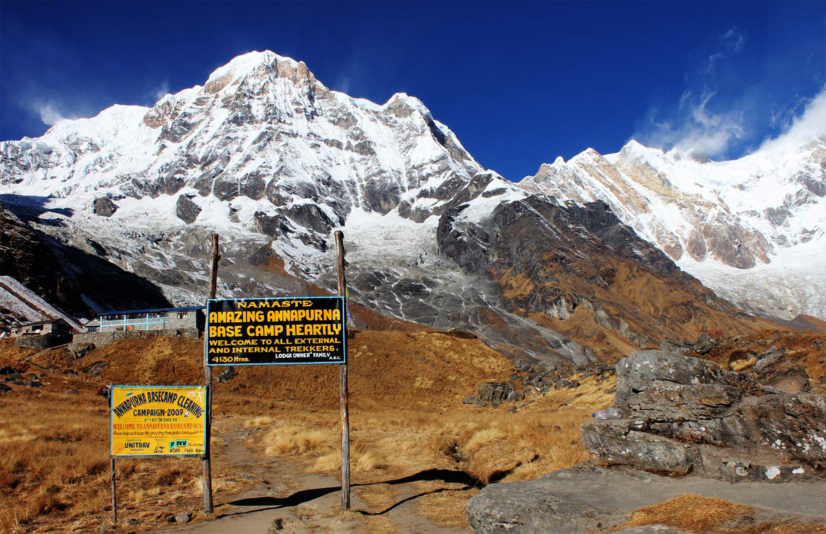 Annapurna Base Camp at sunrise surrounded by the snowy Annapurna Himalaya, Nepal